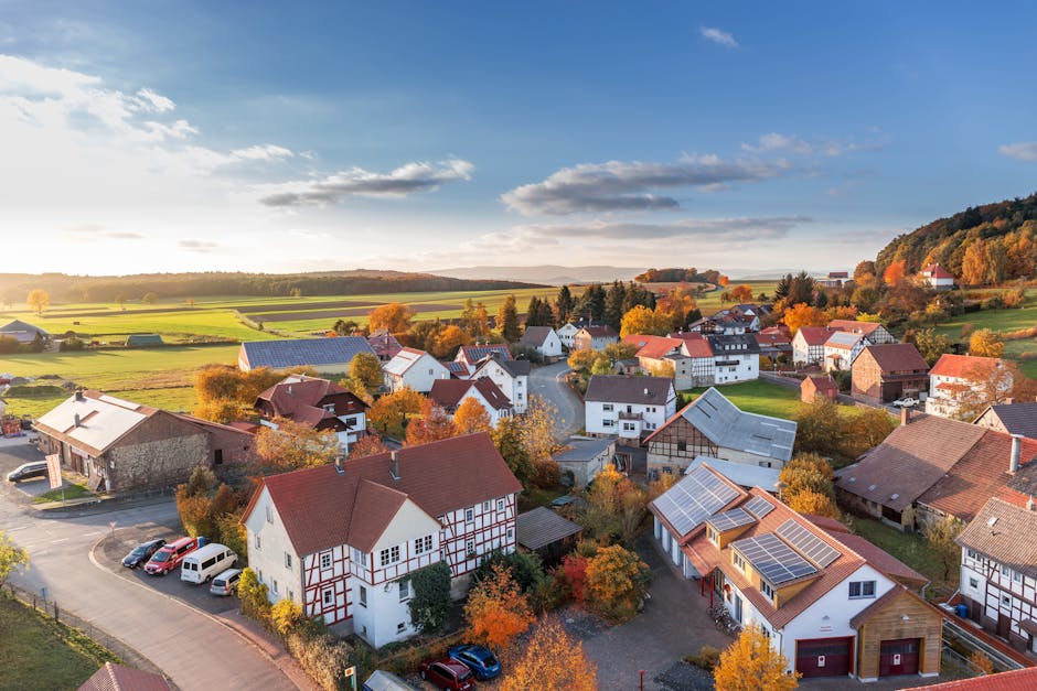 pexels-photo-280221-280221 Charming aerial view of a rural village in autumn with vivid colors and clear skies.